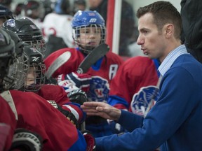 Leggatt behind the bench during a game.