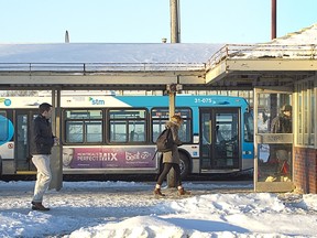 People walk to the ageing Dorval STM bus terminal on February 16, 2014.