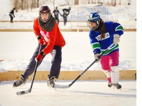 Players from the Flying V’s, left, and the Grumpy Cats compete in the women’s division.