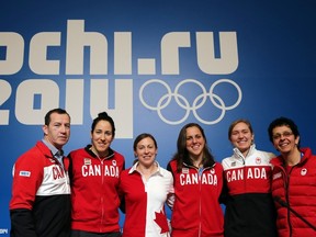 Ice Hockey Canadian Women team players (from R) Danielle Goyette, Brianne Jenner, Caroline Ouellette, Jayna Hefford, Lauriane Rougeau, and their coach kevin Dineen, pose after a press conference on February 5, 2014 in Sochi, two days ahead of the opening ceremony of the 2014 Sochi Winter Olympic games.   AFP PHOTO / LOIC VENANCELOIC VENANCE/AFP/Getty Images