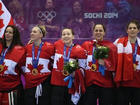 Shannon Szabados #1, Meghan Agosta-Marciano #2, Jocelyne Larocque #3, Lauriane Rougeau #5 and Rebecca Johnston #6 celebrate during medal ceremony in Sochi.