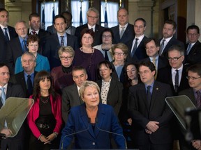Quebec Premier and Parti Quebecois Leader Pauline Marois calls for a general provincial election, while standing in front of her cabinet, Wednesday, March 5, 2014 in Quebec City. Quebecers will vote on a general election on April 7. How have Marois, Liberal leader Philippe Couillard and and Francois Legault of the Coalition Avenir Quebec fared during the first, possibly defining 48 hours of the campaign? THE CANADIAN PRESS/Jacques Boissinot