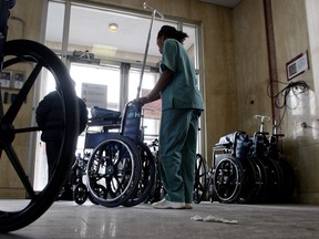 In this file picture from 2008, a hospital worker moves wheelchairs at the Sacre Coeur hospital. After years of promises and studies, are any of the parties running in this Quebec election able to improve a health care system many critics describe as being sick itself? (THE GAZETTE/Phil Carpenter)