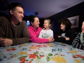 Nicholas Ternynck, left to right, Francoise Lemaitre, Veronika Ternynck, Julien Gagnier and Charlotte Ternynck chat around the dinning room table in Pincourt on Monday March 24, 2014.