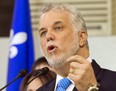 Liberal leader Philippe Couillard campaigning at a window manufacturing plant Friday in Blainville. THE CANADIAN PRESS/Ryan Remiorz