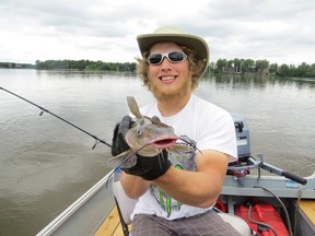 My son Kevin and his smiling catfish.
Smiling because it probably knew it was going back in the water.