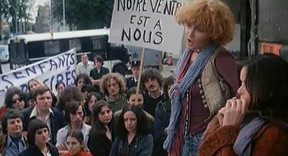 Valérie Mairesse, with the curly red hair, plays Pomme  the one who does sing, in the Agnes Varda film, L'une chante, l'autre pas, whichis being shown at Cinémathèque Québécoise for International Women's Day.