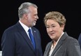 PQ leader Pauline Marois walks past Liberal leader Philippe Couillard prior to the leaders' debate on March 20 in Montreal. The last week of this campaign has been kicked off with personal attacks and suggestions that Islamic fundamentalism is threatening Quebec.  THE CANADIAN PRESS/Paul Chiasson