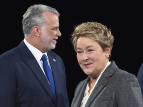 PQ leader Pauline Marois walks past Liberal leader Philippe Couillard prior to the leaders' debate on March 20 in Montreal. The last week of this campaign has been kicked off with personal attacks and suggestions that Islamic fundamentalism is threatening Quebec.  THE CANADIAN PRESS/Paul Chiasson