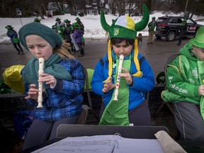 Mount Pleasant school band members Hannah Mumby, left, Gabriel Betito, middle, and Edward de la Durantaye performed on the float.