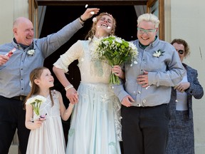 Nikki Pettit (C) and Tanya Ward (2R) are showered with confetti after their wedding ceremony in Brighton, southern England on March 29, 2014. Gay couples across England and Wales said "I do" as a law legalising same-sex marriage came into effect at midnight, the final stage in a long fight for equality.  (LEON NEAL/AFP/Getty Images)