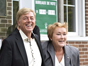 In this file photo from September of 2012,  Parti Quebecois Leader Pauline Marois and her husband Claude Blanchet are pictured in Beaupre, Que. Marois flatly denied a report on Monday that her husband solicited $25,000 from an engineering executive before her successful bid for the Parti Quebecois leadership in 2007. THE CANADIAN PRESS/Jacques Boissinot