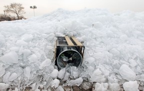 Piles of ice have knocked over garbage cans and park benches at Valois Bay in Dorval on Friday April 18, 2014.