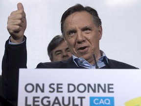 Coalition Avenir Quebec Leader Francois Legault gives the thumbs up at a news conference this week in Quebec City. Legault’s confidence seems unshaken despite poll numbers in this campaign placing his party in place. But just how much clout will the CAQ wield after the election? And how much could the existence of a third party complicate the PQ and Liberals’ quest for a majority government on election night?  THE CANADIAN PRESS/Jacques Boissinot