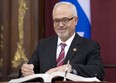Quebec Finance Minister Carlos Leitao is sworn in during a ceremony, Wednesday, April 23, in Quebec City.