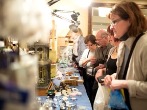 People gather to take in all the detail of the exhibits.