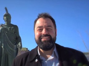 Montreal director Tony Asimakopoulos, above,  is asking for money to make A Walk in Park Ex, a film about the colourful, multicultural Park Extension neighbourhood. Note that the statue of Greek goddess Athena, behind him, has got her hand out, too. Or maybe it's a gesture of support?
