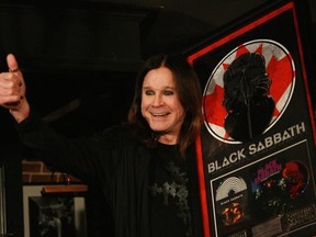 Ozzy Osbourne accepts platinum records from Universal Music Canada at Black Sabbath’s Montreal press conference (Photo by Mitch Lafon)