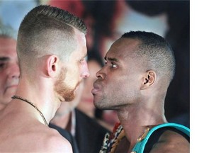 Adonis Stephenson, right, and  Andrzej Fonfara stare each other down during weigh-in Friday May 23, 2014, for their light heavyweight bout at the Bell Centre the next night.