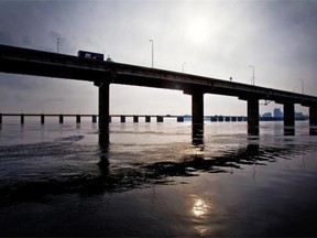 The sun has been setting on the Champlain Bridge after years of deterioration and neglect. Whether tolls should be charged on the bridge’s replacement is a subject of public debate.