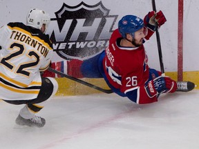 Montreal Canadiens defenceman Josh Gorges gets tripped by Boston Bruins right wing Shawn Thornton, left, during game 4 of the second round of NHL playoff action at the Bell centre in Montreal on Thursday May 8, 2014. No penalty was called on the play. (Allen McInnis / THE GAZETTE)