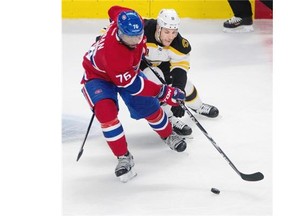 Boston Bruins centre Gregory Campbell, right, tries to hold Montreal Canadiens defenceman P.K. Subban back during the second of NHL payoff action at the Bell centre in Montreal on Tuesday May 6, 2014.