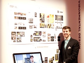 Brendan McMullen poses with the ad work which landed him his first job in the industry.