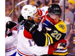 Bruins’ Daniel Paille and Canadiens’ Rene Bourque get into a scuffle in the second period on Saturday in Boston.