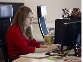 Co-founder Tanya Short works at Kitfox Games on St-Laurent Blvd. in Montreal Friday, May 2, 2014, where she is a designer. They recently released a Role-playing game titled Shattered Planet.