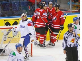 Canada’s players celebrate after Joel Ward scored against Italy during the Group A preliminary round match at the Ice Hockey World Championship in Minsk, Belarus, Friday, May 16, 2014.
