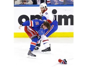 Canadiens’ Brandon Prust, right, and Rangers’ Derek Dorsett trade punches during the first period of Game 3 of the Eastern Conference final on Thursday in New York.