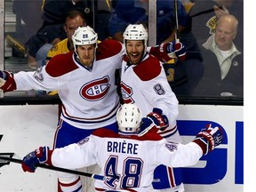 Canadiens’ Dale Weise, left, celebrates his first-period goal with Brandon Prust and Daniel Brière during Game 7 at the TD Garden in Boston on Wednesday night. Alex Trautwig/Getty Images