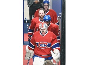 Canadiens goalie Dustin Tokarski leads teammates Mike Weaver, David Desharnais and Michael Bournival from the dressing room for warm-ups prior to Game 2 of their Eastern Conference final playoff series against the New York Rangers in Montreal Monday May 19, 2014. Tokarski was a surprise starter in place of the injured Carey Price.