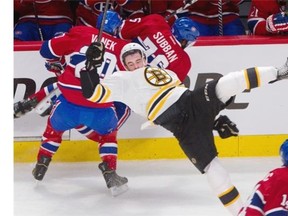 The Canadiens outhit the big, bad Bruins 36-31: Boston right winger Reilly Smith gets knocked to the ice by Canadiens left winger Thomas Vanek, left, and defenceman P.K. Subban during the second of NHL payoff action at the Bell centre in Montreal on Tuesday May 6, 2014.
