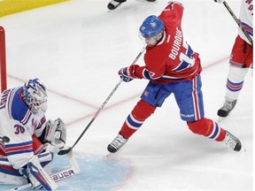 Canadiens’ Rene Bourque is stopped by Rangers goalie Henrik Lundqvist in the first period of the Eastern Conference Final in Montreal on Saturday.