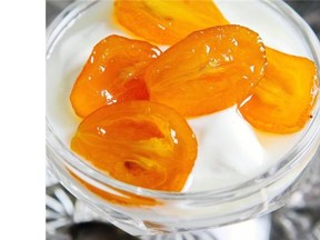Candied kumquats and their syrup served over Greek yogurt.