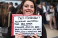 OMG! It's like a novel! A film fan waits outside the Palais des Festivals in the hope of getting a ticket to Clouds of Sils Maria, at the Cannes Film Festival on May 24, 2014 in Cannes, France.  (Photo by Neilson Barnard/Getty Images)