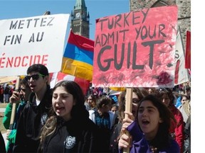 Demonstrators march from Parliament Hill as they mark the 99th anniversary of the 1915 Armenian Massacre Thursday April 24, 2014 in Ottawa.