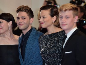 When it comes to film festivals, Montreal filmmaker Xavier Dolan really gets around. This photo was taken at the Cannes Film Festival on May 22, 2014. Anne Dorval, left, Xavier Dolan,  Suzanne Clement and  Antoine-Olivier Pilon pose before the screening of Dolan's film Mommy. (Bertrand Langlois/AFP/Getty Images)