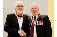 Veteran rocker Ronnie Hawkins receives an honorary Officer of the Order of Canada medal from Gov. Gen. David Johnston during a ceremony at Rideau Hall on Wednesday.