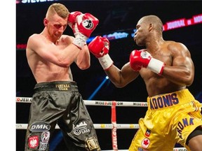 “Everyone gets knocked down, but I came back strong. I showed the world because I’m a true champion,” Adonis Stevenson, right, stated in the ring moments following his unanimous decision over Andrzej Fonfara, his WBC light-heavyweight title bout in Montreal on Saturday televised in the U.S. by Showtime — the first time the Quebecer has fought for that particular specialty network with a subscription base of about 23 million.