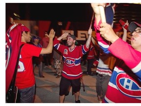 Fans celebrate the series win by the Habs outside the Bell Centre following Game 7 on Wednesday May 14, 2014.