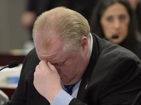 Toronto Mayor Rob Ford attends a budget committee at City Hall in Toronto on Wednesday January 22, 2014. Rob Ford's lawyer says the Toronto mayor will take a leave of absence to seek help for substance abuse. THE CANADIAN PRESS/Frank Gunn