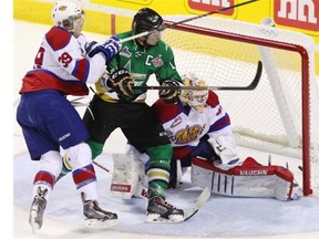 Val-d’Or Foreurs Samuel Henley scores on Edmonton Oil Kings goalie Tristan Jarry while checked by Oil Kings Brett Pollock, to tie the game at 3-3 during third period Memorial Cup hockey action in London, Ontario on Tuesday, May 20, 2014.