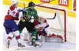 Val-d’Or Foreurs Samuel Henley scores on Edmonton Oil Kings goalie Tristan Jarry while checked by Oil Kings Brett Pollock, to tie the game at 3-3 during third period Memorial Cup hockey action in London, Ontario on Tuesday, May 20, 2014.