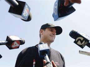 San Francisco 49ers coach Jim Harbaugh speaks to reporters during an NFL football rookie camp in Santa Clara, Calif., Friday, May 23, 2014.