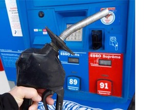 A fuel nozzle is shown at a Montreal gas station on Wednesday, April 23, 2014. It’s not unusual for gas prices to rise around this time of year, when refineries switch from producing diesel and heating fuel to gasoline. But analysts say there are a few aggravating factors that are making this year’s bump especially painful.