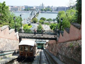 A funicular on the Buda side of Budapest takes visitors to the top of Castle Hill for a view of Chain Bridge and Pest on the other side.