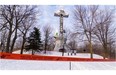 Six Greenpeace activists scaled the cross on Montreal’s Mount Royal at 6 a.m., on Tuesday, March 18, 2014, and unfurled a large vertical banner that said ‘Justice?’ The organization is asking Resolute Forest Products to work with Greenpeace in collaboration with other environmental groups to ensure that conservation and protection of the forests, animal habitats and first nations rights are respected.