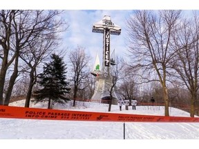 Six Greenpeace activists scaled the cross on Montreal’s Mount Royal at 6 a.m., on Tuesday, March 18, 2014, and unfurled a large vertical banner that said ‘Justice?’ The organization is asking Resolute Forest Products to work with Greenpeace in collaboration with other environmental groups to ensure that conservation and protection of the forests, animal habitats and first nations rights are respected.